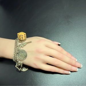 Rare Vintage Coro Charm Bracelet with 10 Charms Bakelite Dice $ Gun Dice in Cage